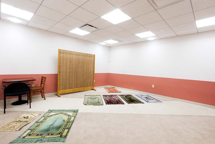 Photo of Prayer Room with mats and table and chair